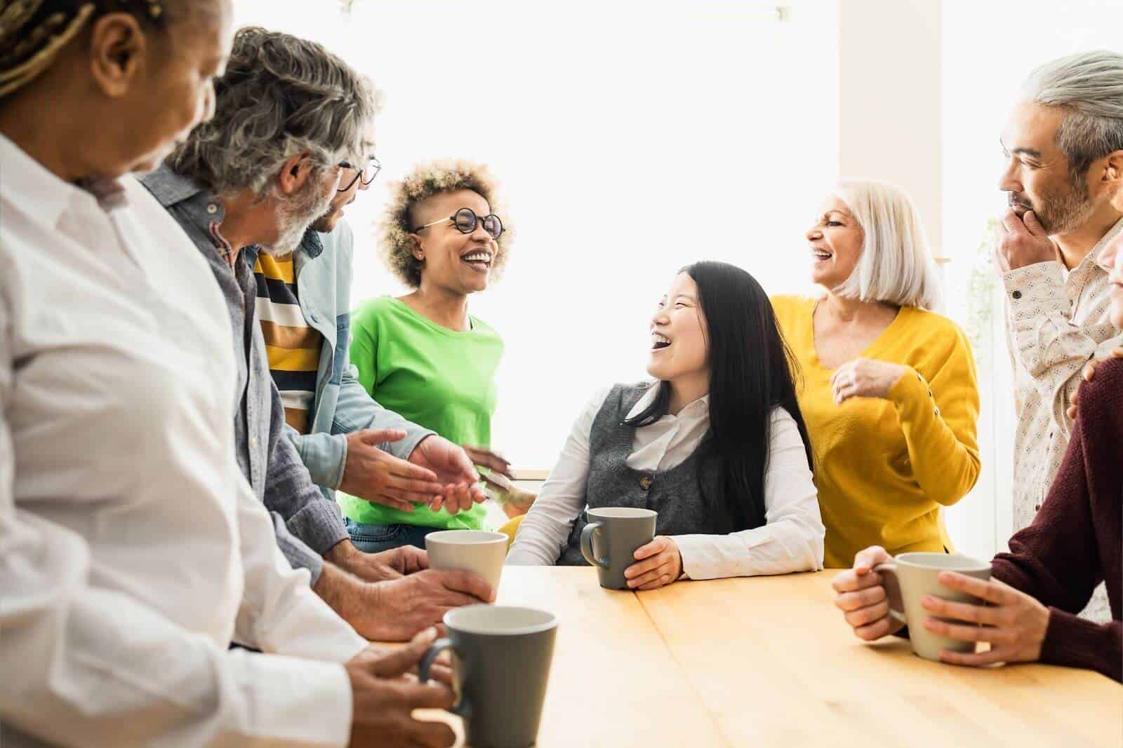 People having coffee at table