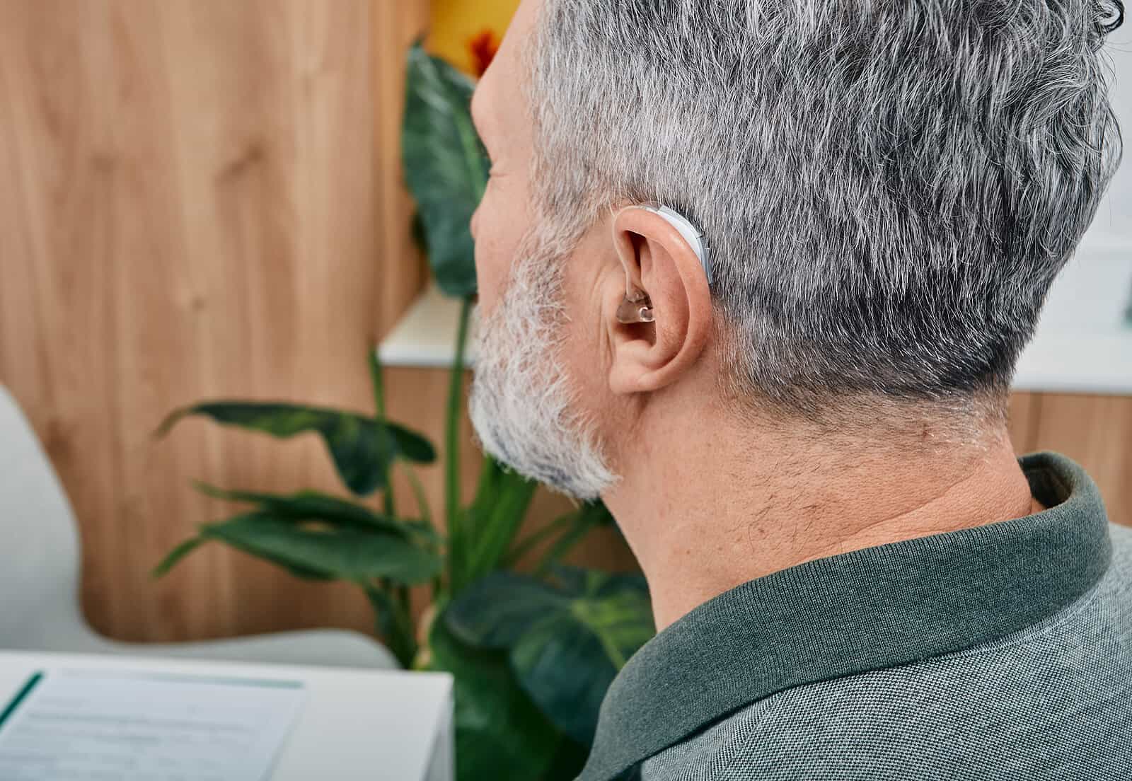 Side view of senior man with hearing aid